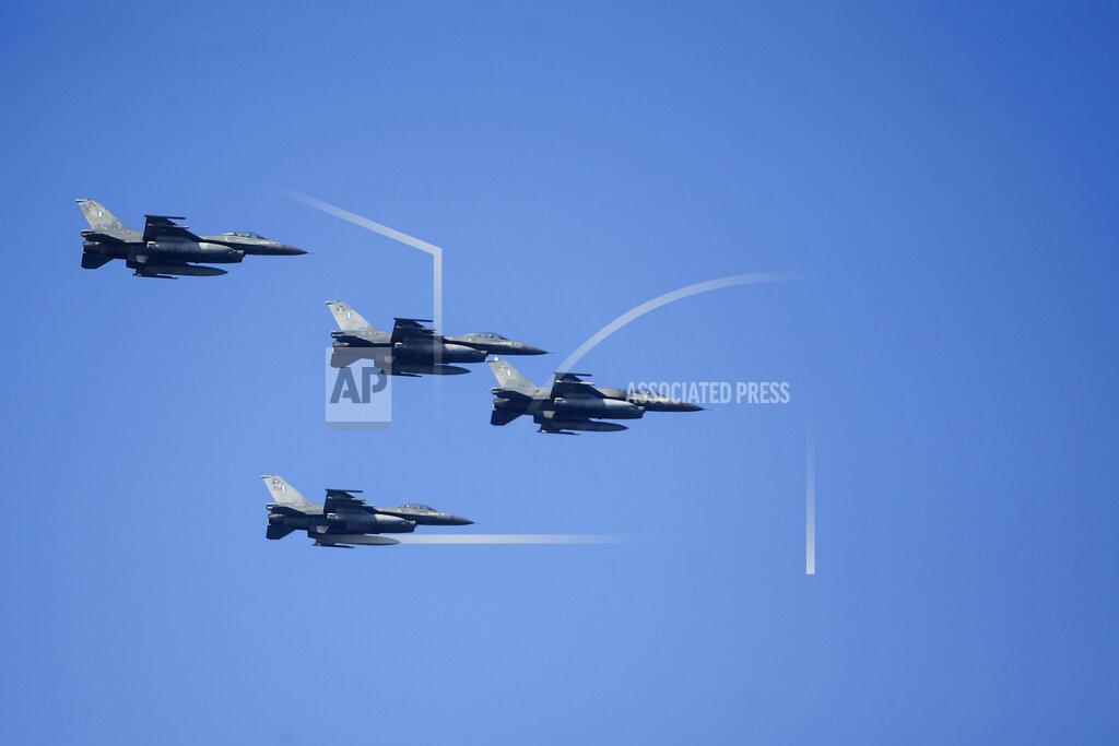 Giannis Papanikos Hellenic Air Force F-16 take part at the annual military parade at the northern port city of Thessaloniki, Greece, on Thursday, Oct. 28, 2021. The parade is held to celebrate Greece's refusal to align itself with a belligerent fascist Italy in 1940 and instead fight a much stronger opponent, a decision which dragged it into World War II and eventually led to a brutal occupation by Nazi Germany. (AP Photo/Giannis Papanikos)