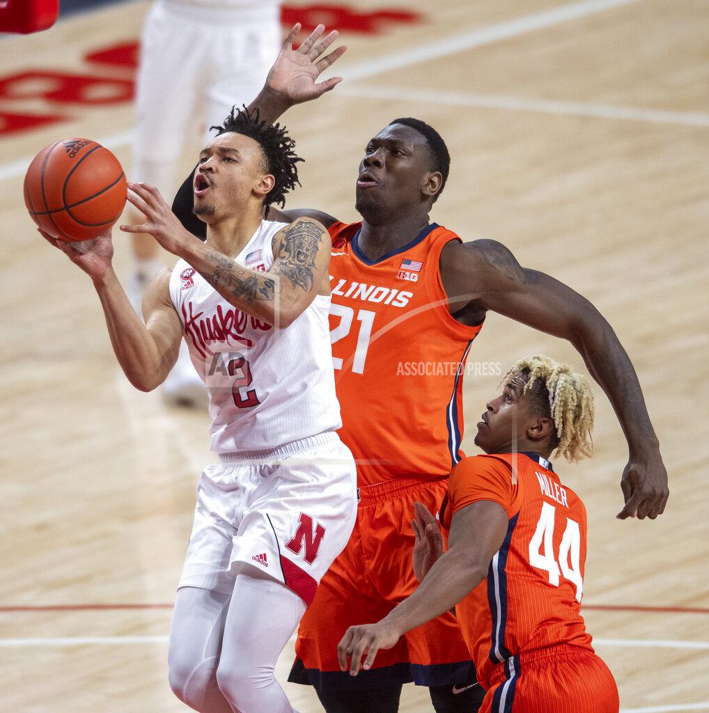 Francis Gardler Nebraska guard Trey McGowens (2) drives to the basket against Illinois' Kofi Cockburn (21) and Adam Miller (44) during the first half of an NCAA college basketball game on Friday, Feb. 12, 2021, in Lincoln, Neb. (Francis Gardler/Lincoln Journal Star via AP)