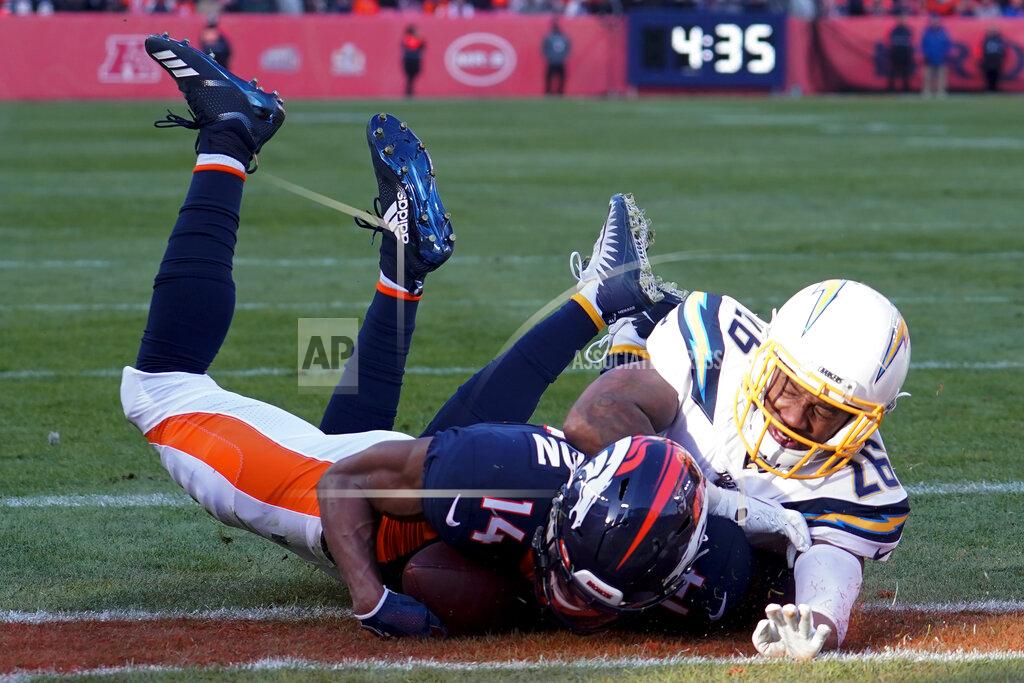 Jack Dempsey Denver Broncos wide receiver Courtland Sutton scores past Los Angeles Chargers cornerback Casey Hayward during the first half of an NFL football game Sunday, Dec. 1, 2019, in Denver. This was Denver Broncos quarterback Drew Lock's first touchdown pass. (AP Photo/Jack Dempsey)