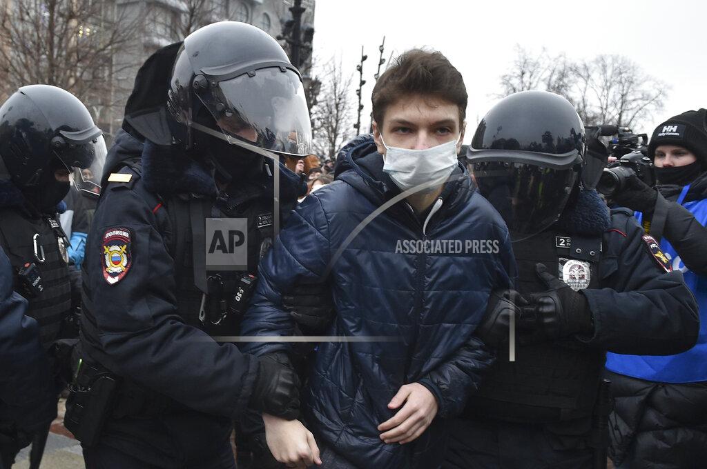 Dmitry Serebryakov Police detain a man during a protest against the jailing of opposition leader Alexei Navalny in Moscow, Russia, Saturday, Jan. 23, 2021. Russian police on Saturday arrested hundreds of protesters who took to the streets in temperatures as low as minus-50 C (minus-58 F) to demand the release of Alexei Navalny, the country's top opposition figure. Navalny, President Vladimir Putin's most prominent foe, was arrested on Jan. 17 when he returned to Moscow from Germany, where he had spent five months recovering from a severe nerve-agent poisoning that he blames on the Kremlin. (AP Photo/Dmitry Serebryakov)
