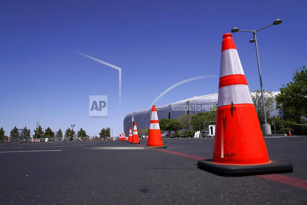 Ross D. Franklin A once bustling Arizona state-run COVID-19 mass vaccination site at State Farm Stadium closed Friday, April 23, 2021, in Glendale, Ariz. Arizona continues to transition outdoor operations to indoor venues. (AP Photo/Ross D. Franklin)