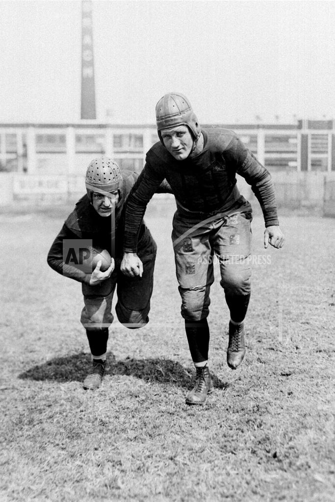 Uncredited FILE - This is a Sept. 13, 1930, file photo showing Chicago Bears professional football players Red Grange, left, and Bronko Nagurski. Nagurski was a powerful and dominant fullback who began his career with the Bears in 1930 and played nine seasons with Chicago. He was one of nine players in the 1930s to be inducted in the first Pro Football Hall of Fame class in 1963, joining Red Grange, Don Hutson, Johnny Blood, Ernie Nevers, Cal Hubbard, Mel Hein, Dutch Clark and Sammy Baugh. (AP Photo/File)