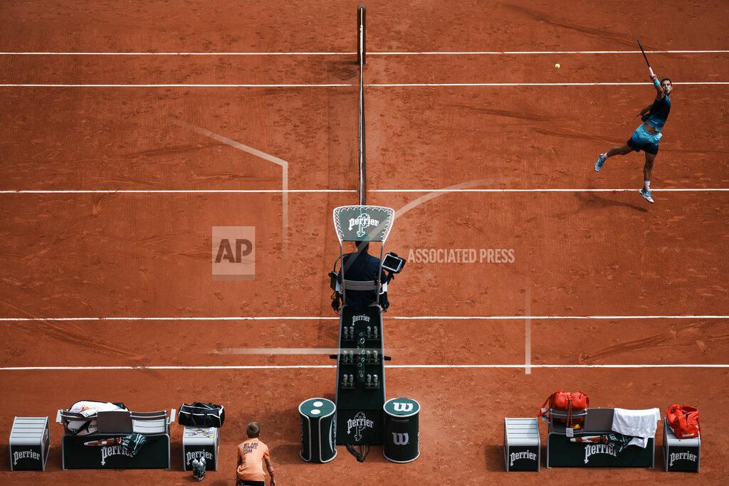 Thibault Camus Serbia's Laslo Djere plays a shot against Russia's Daniil Medvedev during their second round match at the French Open tennis tournament in Roland Garros stadium in Paris, France, Thursday, May 26, 2022. (AP Photo/Thibault Camus)