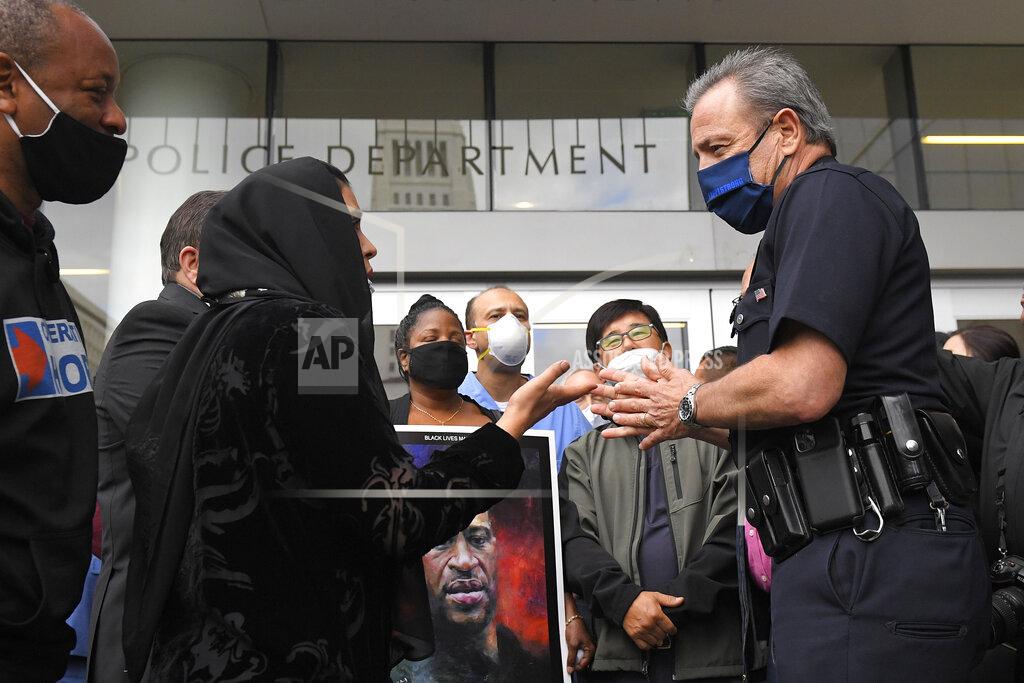 Mark J. Terrill Los Angeles Police Department Chief Michel Moore speaks to members of professional associations and the interfaith community during a vigil with at LAPD headquarters, Friday, June 5, 2020, in Los Angeles. (AP Photo/Mark J. Terrill)