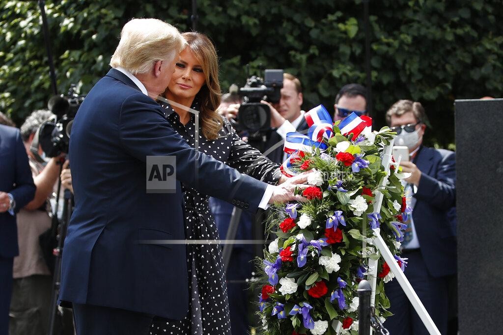 Alex Brandon President Donald Trump, accompanied by first lady Melania Trump, places a wreath at the Korean War Veterans Memorial, Thursday, June 25, 2020, in Washington. (AP Photo/Alex Brandon)