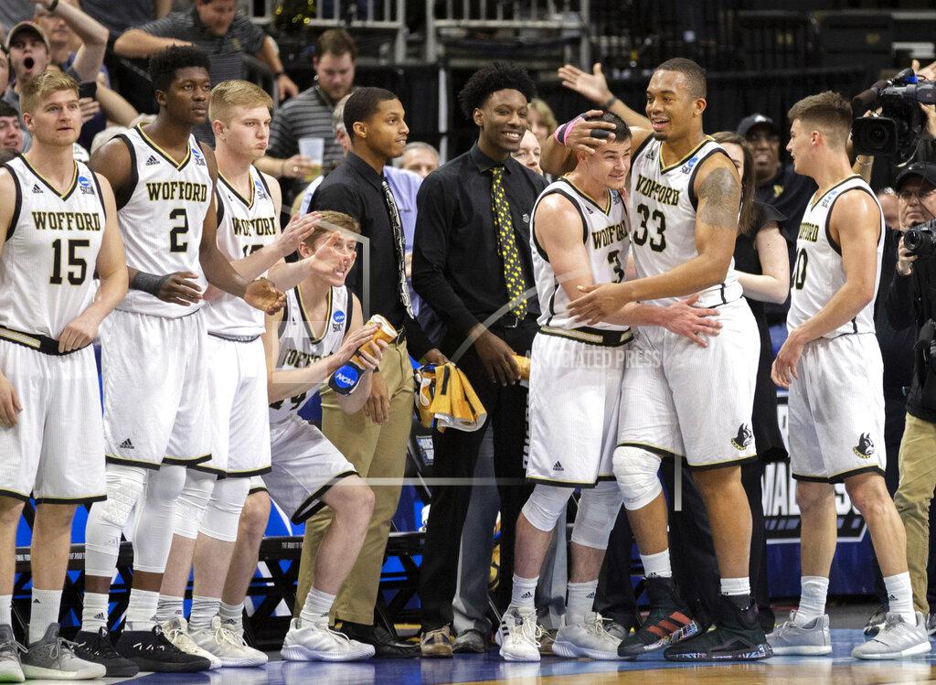Stephen B. Morton Wofford players celebrate during the final moments against Seton Hall in a first-round game in the NCAA men’s college basketball tournament in Jacksonville, Fla. Thursday, March 21, 2019. (AP Photo/Stephen B. Morton)
