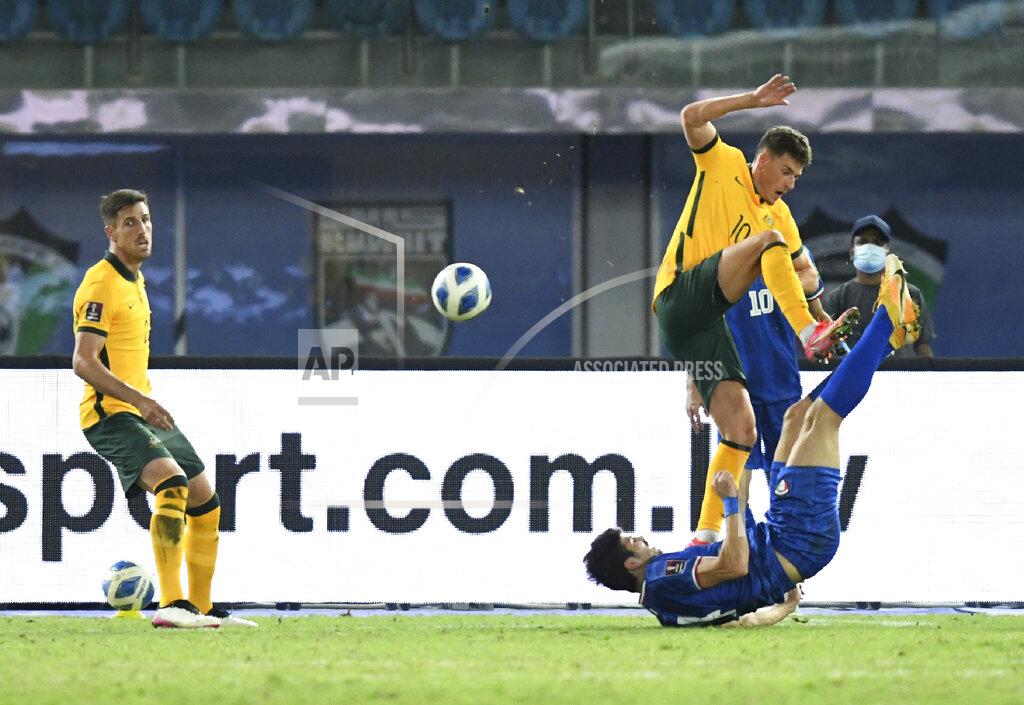 Jaber Abdulkhaleg Kuwait's Shabaib Alkhaldi, right, fights for the ball with Australia's Ajdin Hrustic during the World Cup 2022 Group B qualifying soccer match between Kuwait and Australia in Kuwait City, Kuwait, Thursday, June 3, 2021. (AP Photo/Jaber Abdulkhaleg)