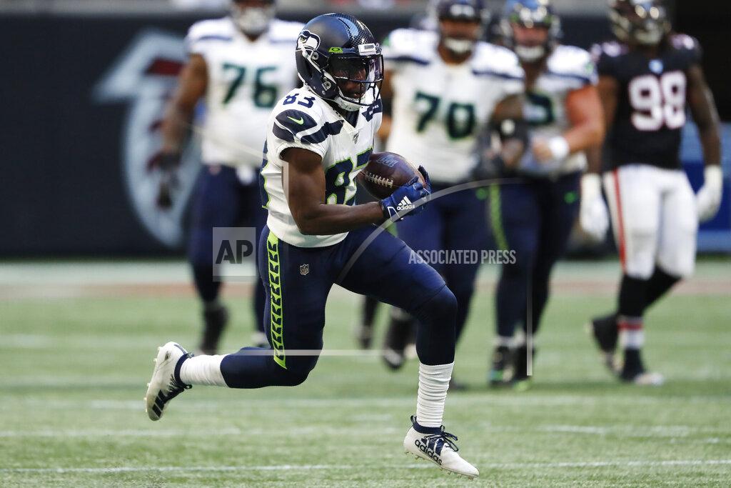 John Bazemore Seattle Seahawks wide receiver David Moore (83) runs against the Atlanta Falcons during the second half of an NFL football game, Sunday, Oct. 27, 2019, in Atlanta. (AP Photo/John Bazemore)