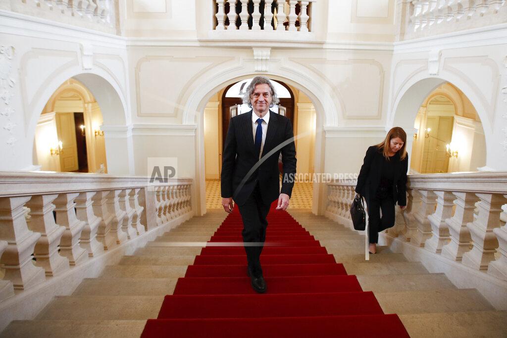 Uncredited Robert Golob, the leader of the Freedom Movement party, arrives for a meeting with President Borut Pahor, in Ljubljana, Slovenia, Tuesday, April 26, 2022. The winner of last weekend's parliamentary election in Slovenia said after the meeting that he hopes to have a new government formed by mid-June. (AP Photo)