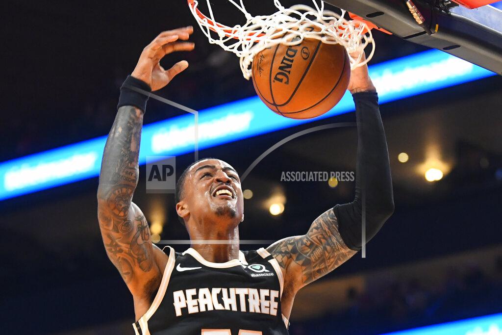 John Amis Atlanta Hawks forward John Collins dunks against the Detroit Pistons during the first half of an NBA basketball game Saturday, Jan. 18, 2020, in Atlanta. (AP Photo/John Amis)