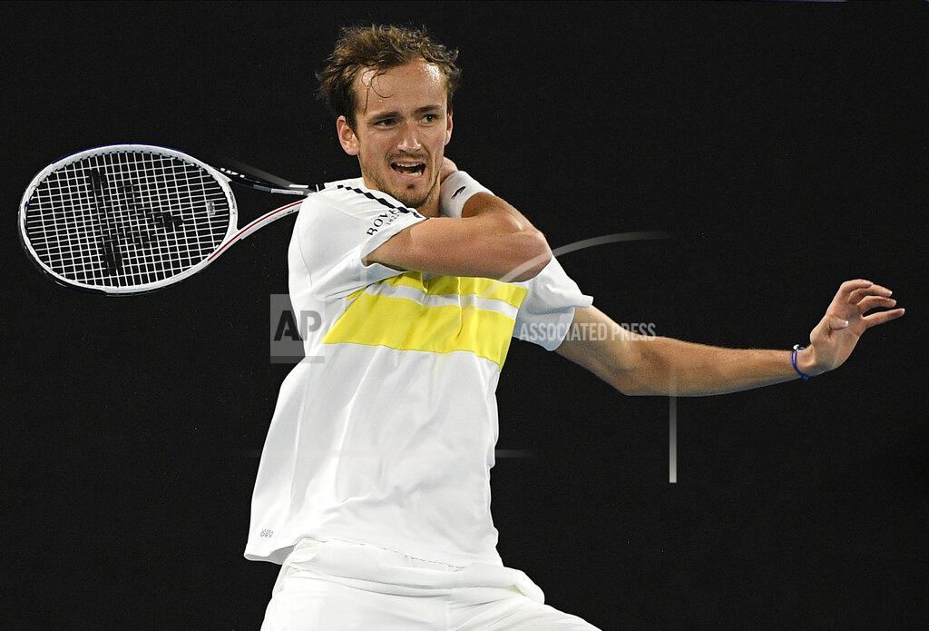 Andy Brownbill Russia's Daniil Medvedev hits a forehand return to Serbia's Novak Djokovic during the men's singles final at the Australian Open tennis championship in Melbourne, Australia, Sunday, Feb. 21, 2021.(AP Photo/Andy Brownbill)