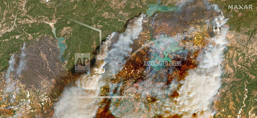 Satellite Image ©2021 Maxar Technologies In this image provided by Maxar, a satellite view of smoke rising from wildfires near Oymapinar Dam, southern Turkey, on Thursday July 29, 2021. Turkish fire crews are continuing to fight deadly blazes in southern Turkey that have burned down homes and forced many evacuations. (Satellite image ©2021 Maxar Technologies via AP)