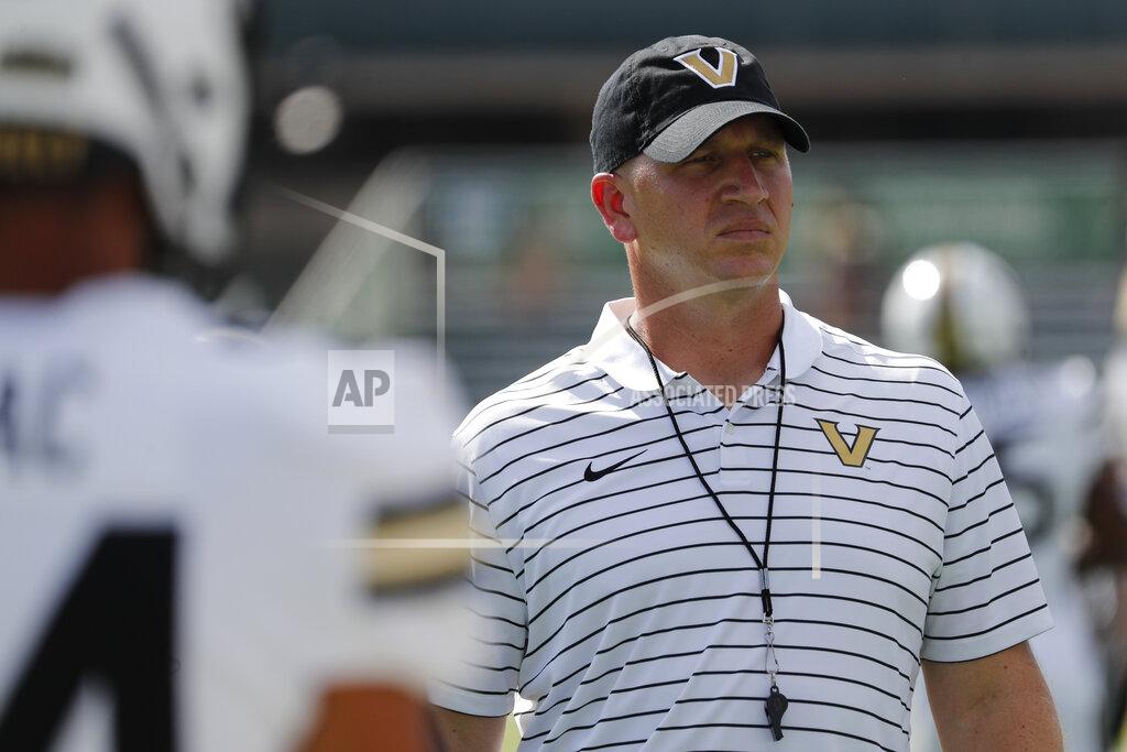 Vanderbilt head coach Clark Lea looks over his team before an NCAA college football game against Hawaii, Saturday, Aug. 27, 2022, in Honolulu. (AP Photo/Marco Garcia)