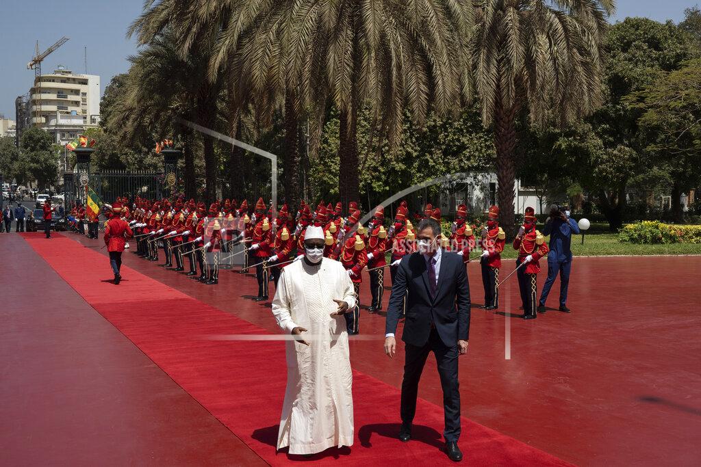 Leo Correa Senegal's President Macky Sall, left, welcomes Spanish Prime Minister Pedro Sanchez prior to a meeting at the presidential palace in Dakar, Senegal, Friday, April 9, 2021. Sanchez is on a mini-tour to Angola and Senegal that are key in the European country's new push to bolster ties with the neighboring continent and mitigate the migration flows that many fear could increase as a consequence of the coronavirus pandemic. (AP Photo/Leo Correa)