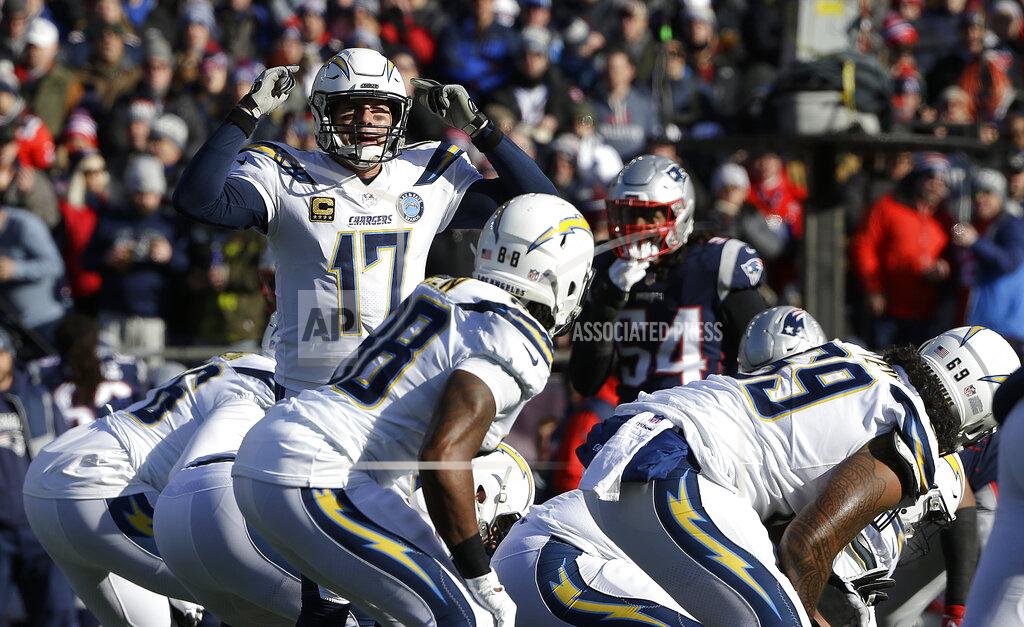 Steven Senne Los Angeles Chargers quarterback Philip Rivers (17) calls signals at the line of scrimmage during the first half of an NFL divisional playoff football game against the New England Patriots, Sunday, Jan. 13, 2019, in Foxborough, Mass. (AP Photo/Steven Senne)