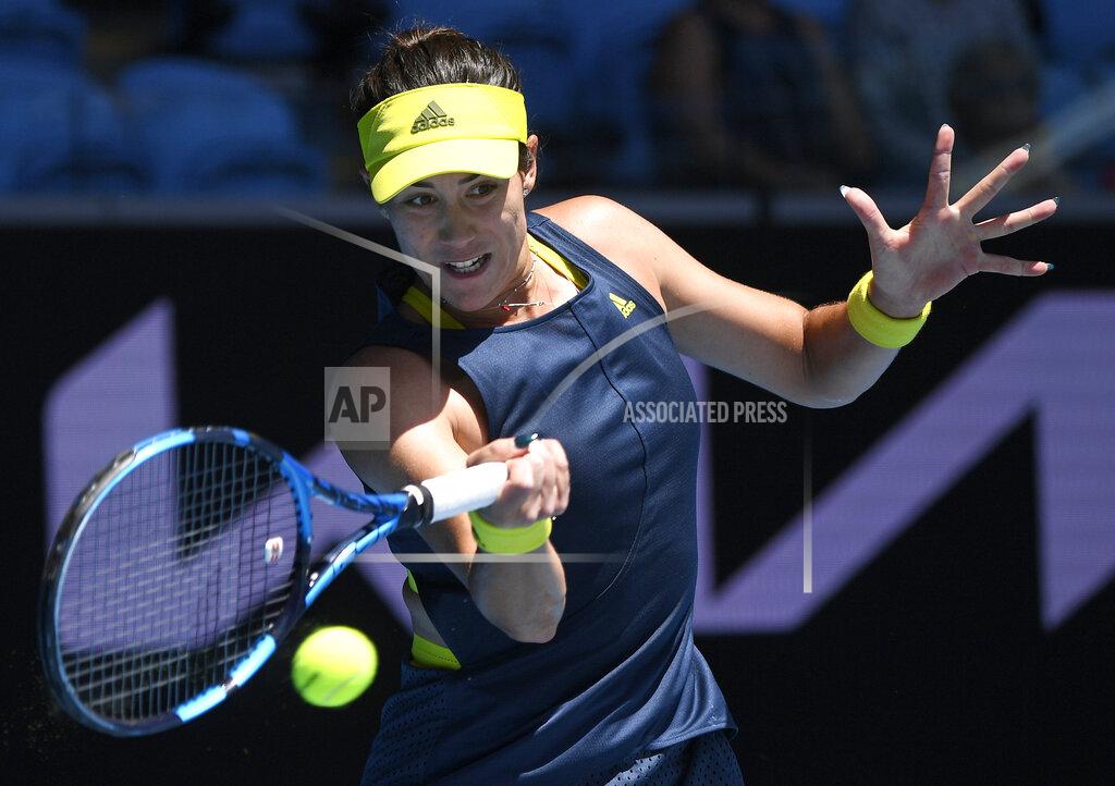 Andy Brownbill Spain's Garbine Muguruza makes a forehand return to Kazakhstan's Zarina Diyas during their third round match at the Australian Open tennis championship in Melbourne, Australia, Friday, Feb. 12, 2021.(AP Photo/Andy Brownbill)