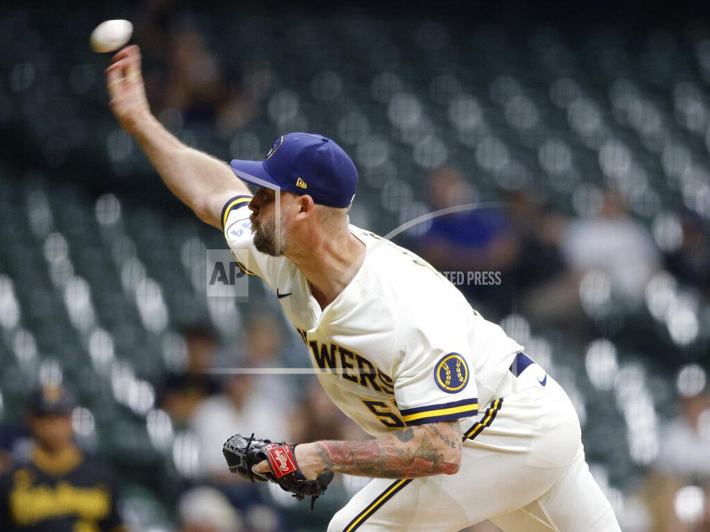 Jeffrey Phelps Milwaukee Brewers' John Axford pitches against the Pittsburgh Pirates during the ninth inning of a baseball game Monday, Aug. 2, 2021, in Milwaukee. (AP Photo/Jeffrey Phelps)