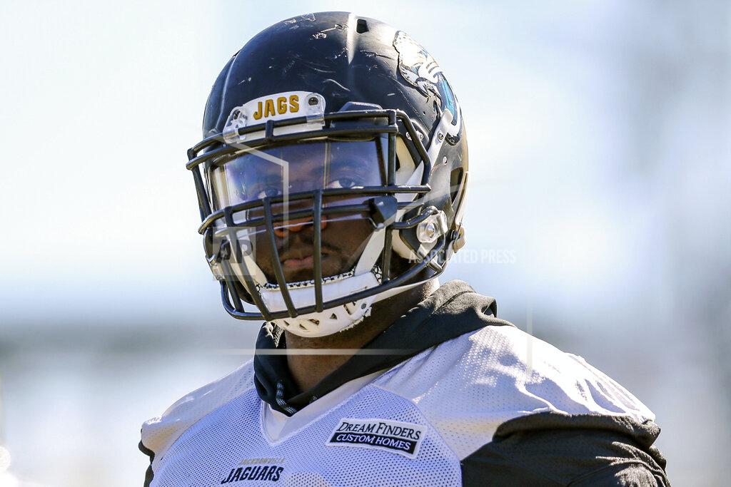 Gary Mccullough FILE - In this Jan. 18, 2018, file photo, then-Jacksonville Jaguars offensive guard Patrick Omameh (77) takes part in a drill during an NFL football practice in Jacksonville, Fla. New Orleans Saints coach Sean Payton says the club has signed veteran offensive lineman Patrick Omameh. (AP Photo/Gary McCullough, File)