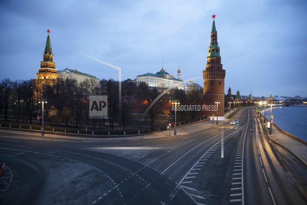 Pavel Golovkin A view of the unusually empty embankment during evening rush hour outside the Kremlin in Moscow, Russia, Wednesday, April 1, 2020. The Russian capital has woken up to a lockdown obliging most people in the city of 13 million to stay home. The government ordered other regions of the vast country to quickly prepare for the same as Moscow, to stem the spread of the new coronavirus. The new coronavirus causes mild or moderate symptoms for most people, but for some, especially older adults and people with existing health problems, it can cause more severe illness or death. (AP Photo/Pavel Golovkin)