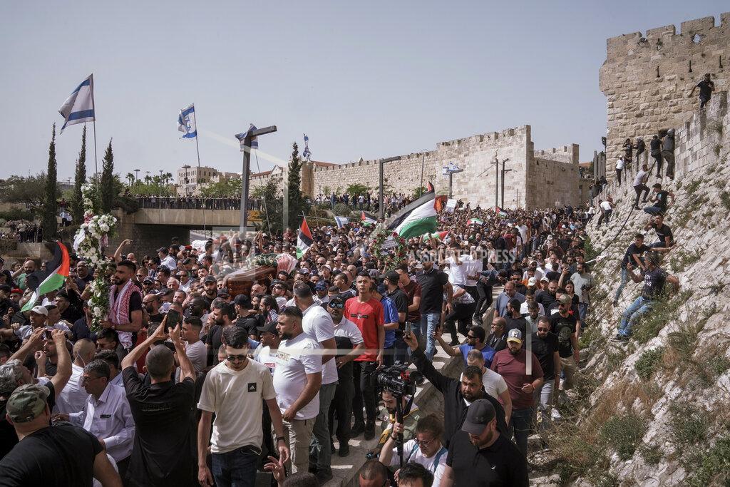 Mahmoud Illean Mourners carry the coffin of slain Al Jazeera veteran journalist Shireen Abu Akleh during her funeral in Jerusalem, Friday, May 13, 2022. Abu Akleh, a Palestinian-American reporter who covered the Mideast conflict for more than 25 years, was shot dead Wednesday during an Israeli military raid in the West Bank town of Jenin. (AP Photo/Mahmoud Illean)