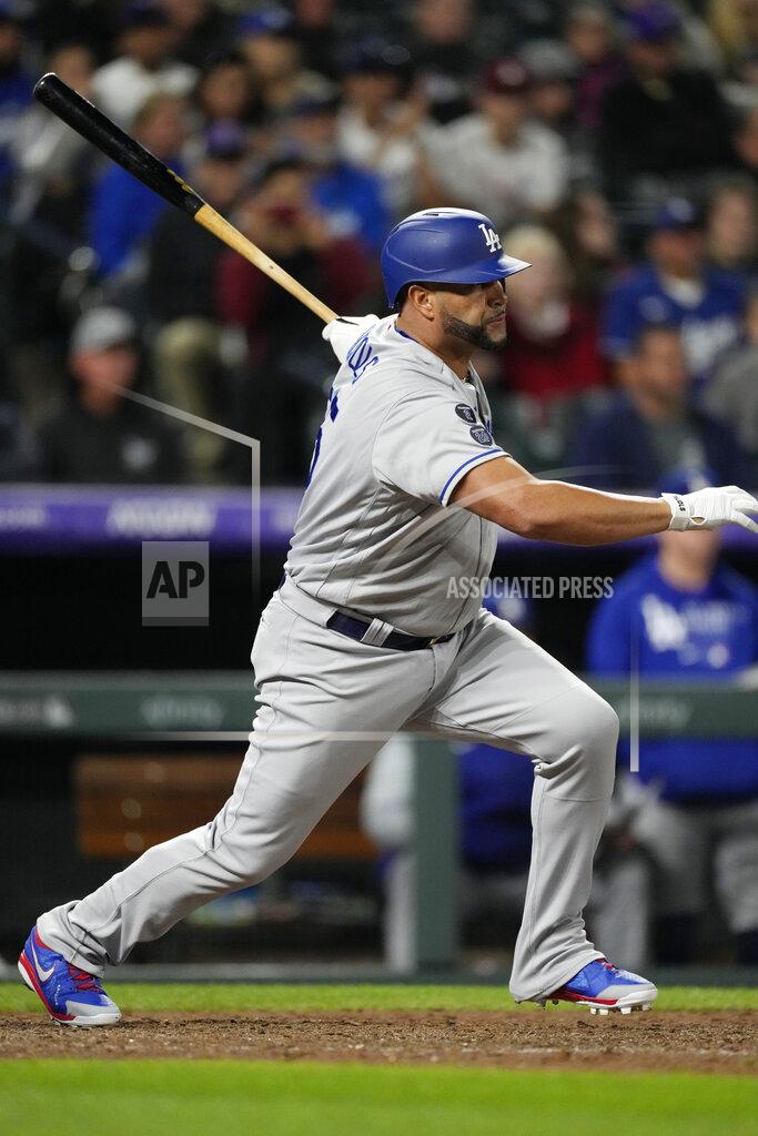 David Zalubowski Los Angeles Dodgers pinch-hitter Albert Pujols follows the flight of his RBI-single off Colorado Rockies relief pitcher Jhoulys Chacin in the 10th inning of a baseball game Tuesday, Sept. 21, 2021, in Denver. The Dodgers won 5-4. (AP Photo/David Zalubowski)