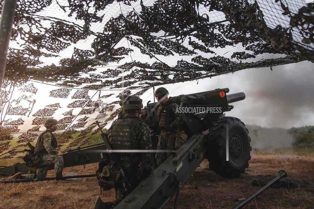 Uncredited In this photo released by the Taiwan Military News Agency, a Taiwan artillery unit conducts a live firing drill to deter a coastal landing force during the Han Guang exercise held on the island of Penghu county, Taiwan, Wednesday, Sept. 15, 2021. Taiwan's annual five-day Han Guang military exercise is designed to prepare the island's forces for an attack by China, which claims Taiwan as part of its own territory. (Military News Agency via AP)