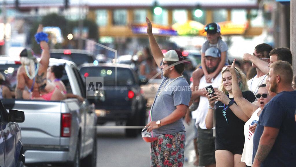 David Tucker In this June 12, 2021 photo, Daytona Truck Meet, enthusiasts pack Atlantic Avenue and sidewalk near the Ocean Center, in Daytona Beach, Fla. (David Tucker/The Daytona Beach News-Journal via AP)