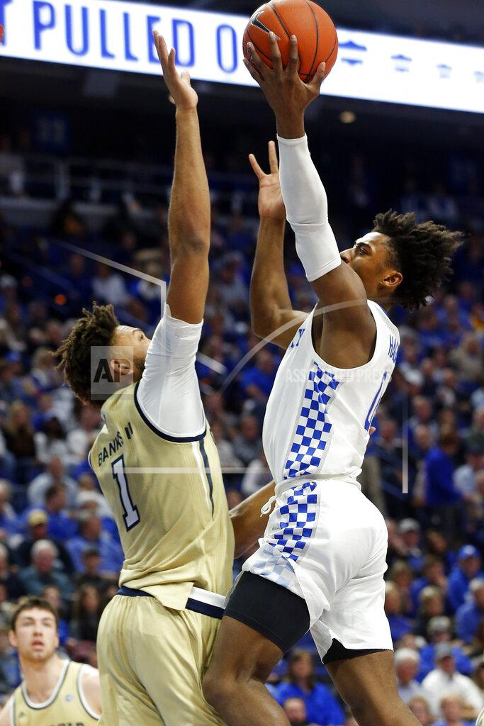 James Crisp Kentucky's Ashton Hagans, right, shoots while pressured by Georgia Tech's James Banks III, left, during the first half of an NCAA college basketball game in Lexington, Ky., Saturday, Dec. 14, 2019. (AP Photo/James Crisp)