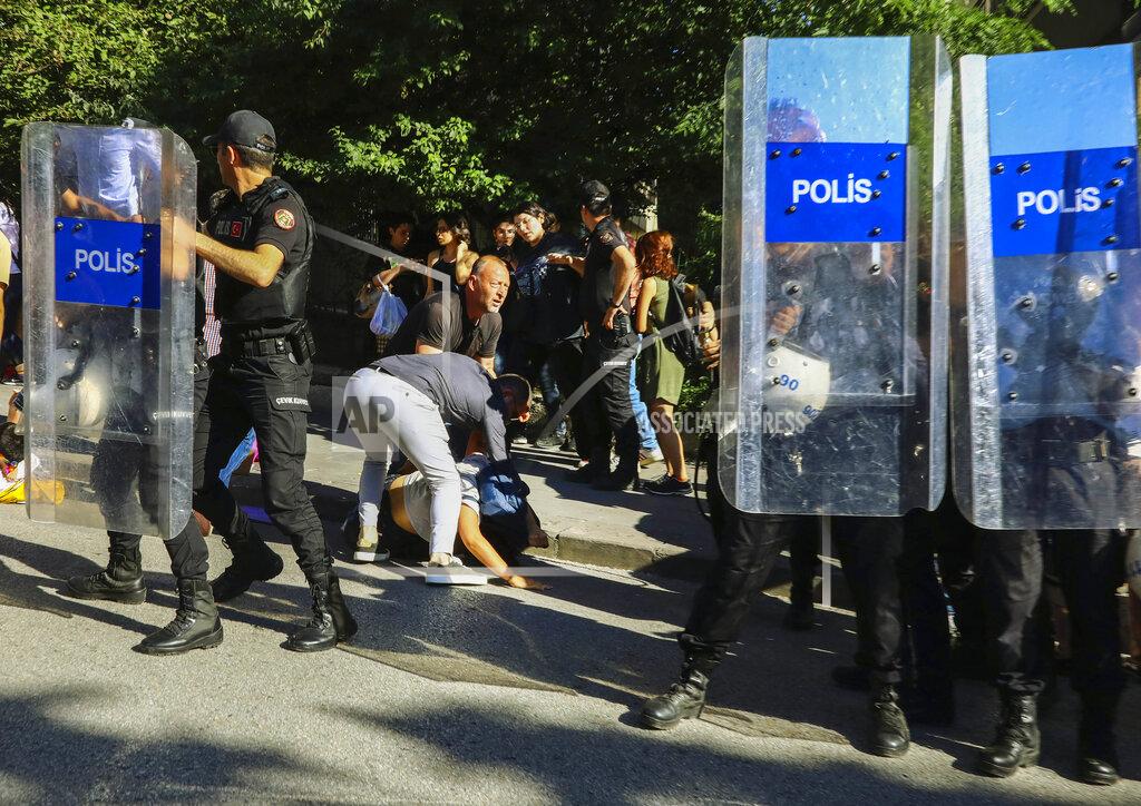 Ali Unal A protester is detained during the LGBTQ Pride March in Ankara, Turkey, Tuesday, July 5, 2022. Police in Turkey’s capital have broken up a LGBTQ Pride march and detained dozens of people. Turkish authorities have banned LGBTQ events. (AP Photo/Ali Unal)