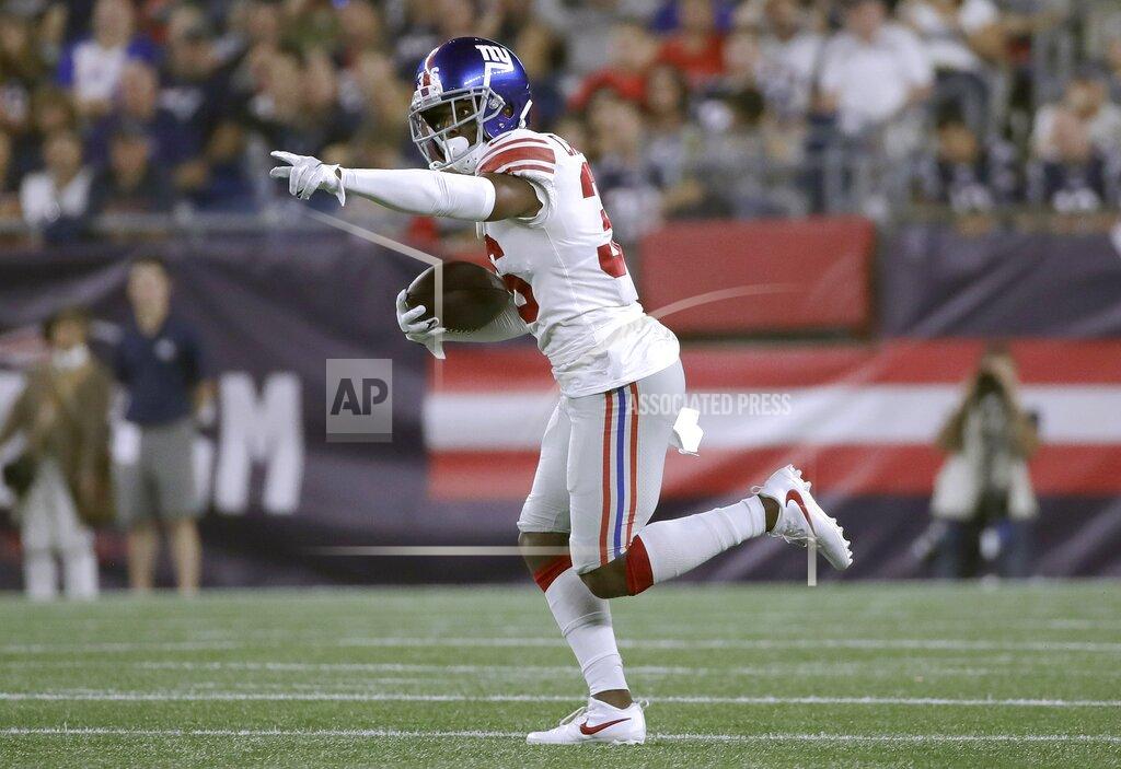 Elise Amendola New York Giants defensive back Sean Chandler runs after intercepting a pass by New England Patriots quarterback Jarrett Stidham in the first half of an NFL preseason football game, Thursday, Aug. 29, 2019, in Foxborough, Mass. (AP Photo/Elise Amendola)