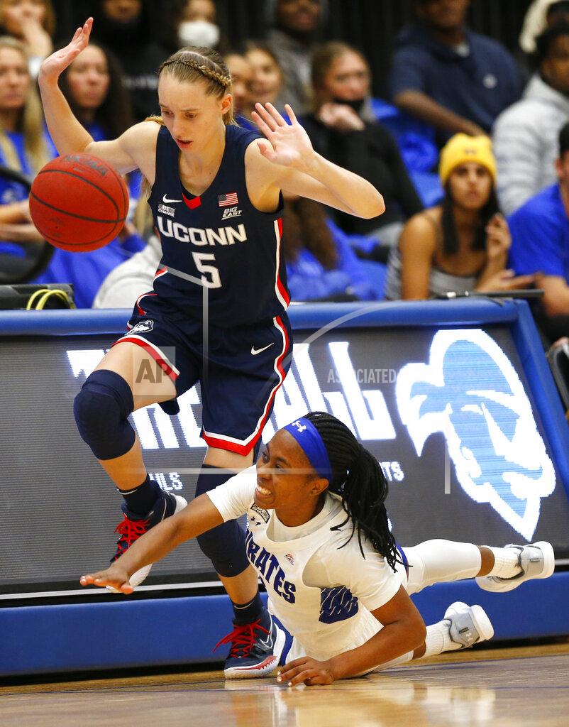 Noah K. Murray Seton Hall guard Mya Jackson (5) loses the ball out of bounds against Connecticut guard Paige Bueckers (5) during the second half of an NCAA college basketball game on Friday, Dec. 3, 2021, in South Orange, N.J. (AP Photo/Noah K. Murray)