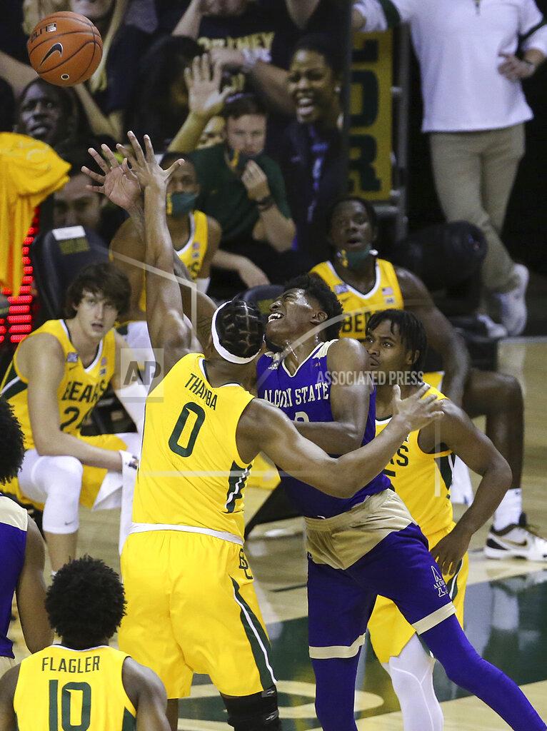 Jerry Larson Alcorn State forward Kobe Wilson (10) is fouled by Baylor forward Flo Thamba (0) as he attempts a shot in the first half of an NCAA college basketball game, Wednesday, Dec. 30, 2020, in Waco, Texas. (AP Photo/ Jerry Larson)