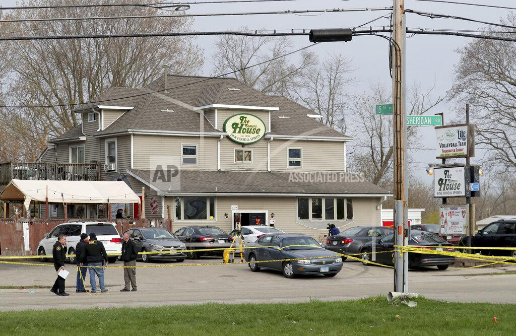 Mike De Sisti Officials investigate the scene of a deadly shooting at Somers House Tavern in Kenosha, Wis., Sunday, April 18, 2021. Several people were killed and two were seriously wounded in a shooting at the busy tavern in southeastern Wisconsin early Sunday, sheriff's officials said. (Mike De Sisti/Milwaukee Journal-Sentinel via AP)