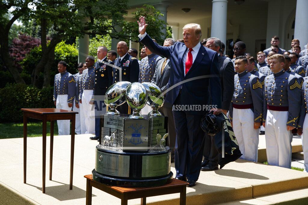 Evan Vucci President Donald Trump waves to audience members after speaking during the presentation of the Commander-in-Chief's Trophy to the U.S. Military Academy at West Point football team, in the Rose Garden of the White House, Monday, May 6, 2019, in Washington. (AP Photo/Evan Vucci)