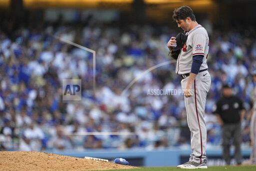 Atlanta Braves pitcher Luke Jackson takes a moment before pitching in the eight inning against the Los Angeles Dodgers in Game 3 of baseball's National League Championship Series Tuesday, Oct. 19, 2021, in Los Angeles. (AP Photo/Ashley Landis)