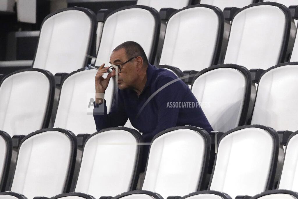 Luca Bruno Juventus' head coach Maurizio Sarri smokes during a Serie A soccer match between Juventus and Roma, at the Allianz stadium in Turin, Italy, Saturday, Aug.1, 2020. (AP Photo/Luca Bruno)