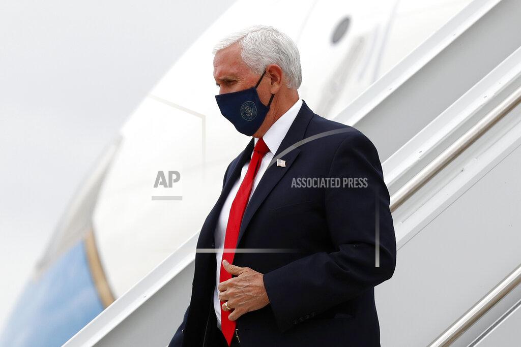 Vice President Mike Pence arrives at Love Field in Dallas, Sunday, June 28, 2020. For more than three years, President Donald Trump instilled such fear in the Republican Party's leaders that most kept criticism of his turbulent leadership or inconsistent politics to themselves. That's beginning to change. While Trump avoids wearing a mask in public, Pence was pictured this weekend wearing a mask and urged other Americans to do the same.(AP Photo/Tony Gutierrez)