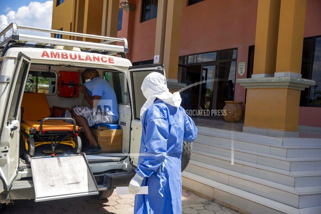 Dieu Nalio Chery Workers of the national ambulance center load a man who was deported from the United States two weeks ago and who is tested positive with the new coronavirus, to take him from the hotel he was being quarantined, to the hospital in Tabarre, Haiti, Sunday, April 19, 2020. (AP Photo/Dieu Nalio Chery)