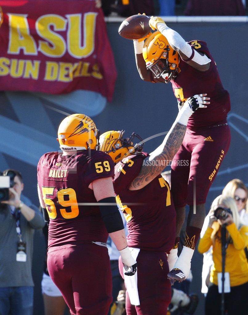 John Locher Arizona State running back Eno Benjamin (3) celebrates with teammates after scoring a touchdown against Fresno State during the first half of the Las Vegas Bowl NCAA college football game, Saturday, Dec. 15, 2018, in Las Vegas. (AP Photo/John Locher)