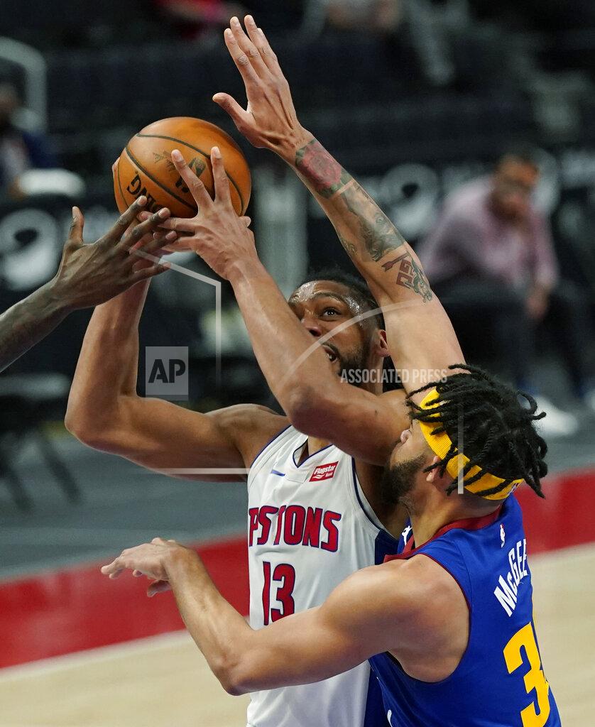 Carlos Osorio Detroit Pistons center Jahlil Okafor (13) is fouled by Denver Nuggets center JaVale McGee (34) during the second half of an NBA basketball game, Friday, May 14, 2021, in Detroit. (AP Photo/Carlos Osorio)