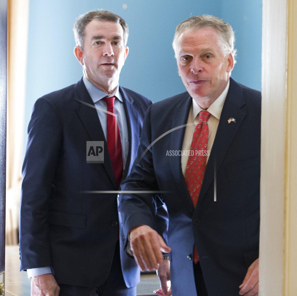 Steve Helber FILE - In this Jan. 9, 2018, file photo, former Virginia Gov. Terry McAuliffe, right, arrives as he and Gov. Ralph Northam, arrive for a press conference at the Capitol in Richmond, Va. Northam announced Thursday, April 8, 2021, that he was backing Terry McAuliffe in the race to succeed him, handing his predecessor one of the contest's most coveted endorsements. (AP Photo/Steve Helber, File)