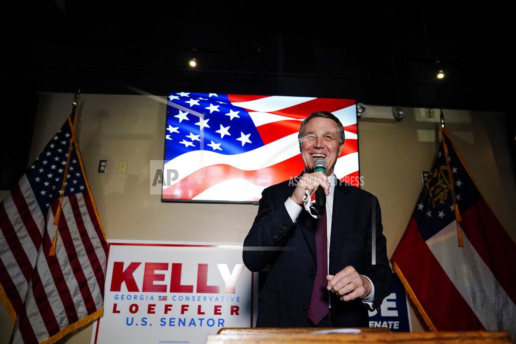 Brynn Anderson Republican candidate for U.S. Senate Sen. David Perdue speaks during a campaign rally on Friday, Nov. 13, 2020, in Cumming, Ga. Perdue and Democratic candidate Jon Ossoff are in a runoff election for the Senate seat in Georgia. (AP Photo/Brynn Anderson)
