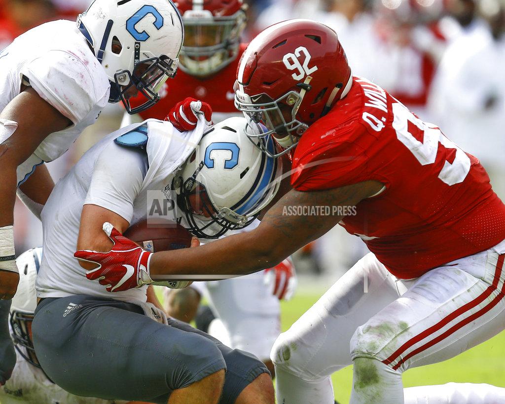 Butch Dill Citadel quarterback Brandon Rainey (16) is stopped by Alabama defensive lineman Quinnen Williams (92) as he tries to carry the ball during the second half of an NCAA college football game, Saturday, Nov. 17, 2018, in Tuscaloosa, Ala. (AP Photo/Butch Dill)