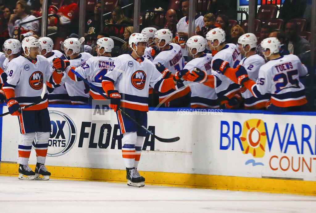 Brynn Anderson New York Islanders center Brock Nelson (29) celebrates with his teammates after scoring during the second period of an NHL hockey game against the Florida Panthers on Thursday, April 4, 2019, in Sunrise, Fla. (AP Photo/Brynn Anderson)