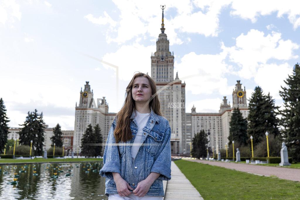 Daniel Kozin Yulia Kukula stands in front of the Moscow State University during her interview with the Associated Press in Moscow, Russia, Friday, May 7, 2021. Kukula, a university student who was accepted for a PhD program in sustainable energy at Arizona State University, may have found a laborious and costly away around the problem of getting her visa to go the university. (AP Photo/Daniel Kozin)