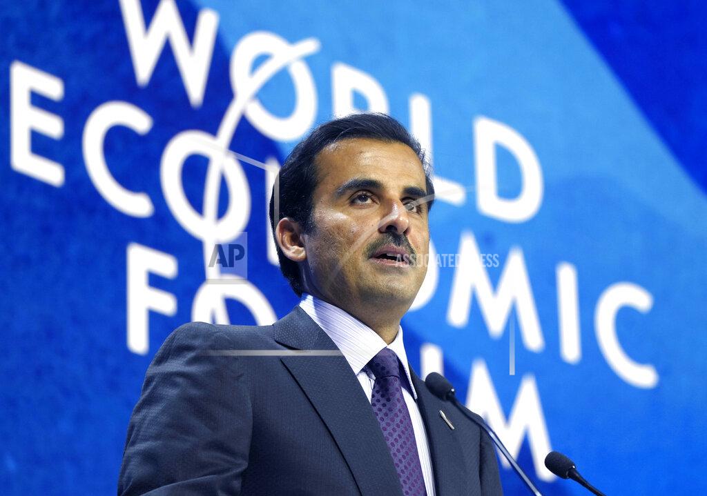 Markus Schreiber The Emir of Qatar, Sheikh Tamim bin Hamad Al Thani speaks during the World Economic Forum in Davos, Switzerland, Monday, May 23, 2022. The annual meeting of the World Economic Forum is taking place in Davos from May 22 until May 26, 2022. (AP Photo/Markus Schreiber)
