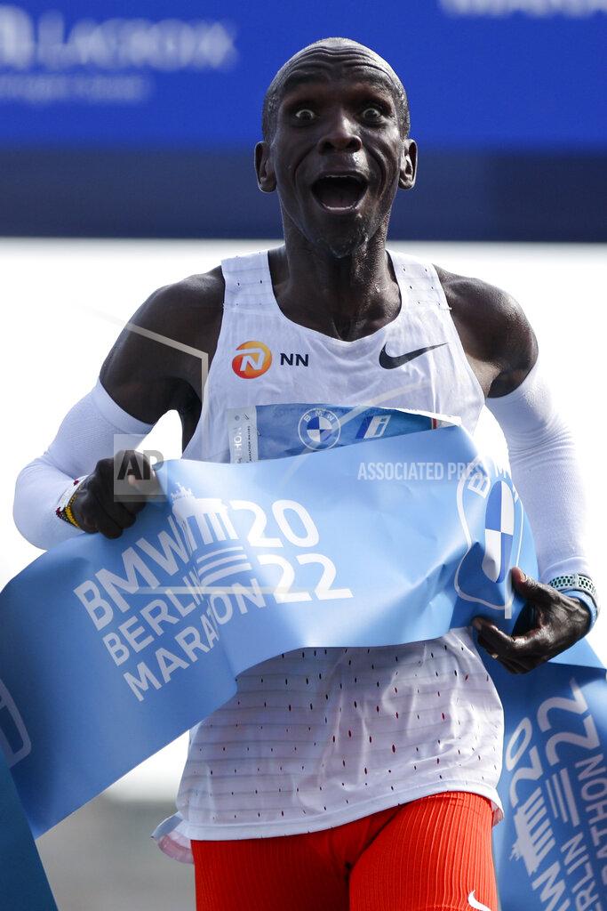 Christoph Soeder Kenya's Eliud Kipchoge crosses the line to win the Berlin Marathon in Berlin, Germany, Sunday, Sept. 25, 2022. Olympic champion Eliud Kipchoge has bettered his own world record in the Berlin Marathon. Kipchoge clocked 2:01:09 on Sunday to shave 30 seconds off his previous best-mark of 2:01:39 from the same course in 2018. (AP Photo/Christoph Soeder)