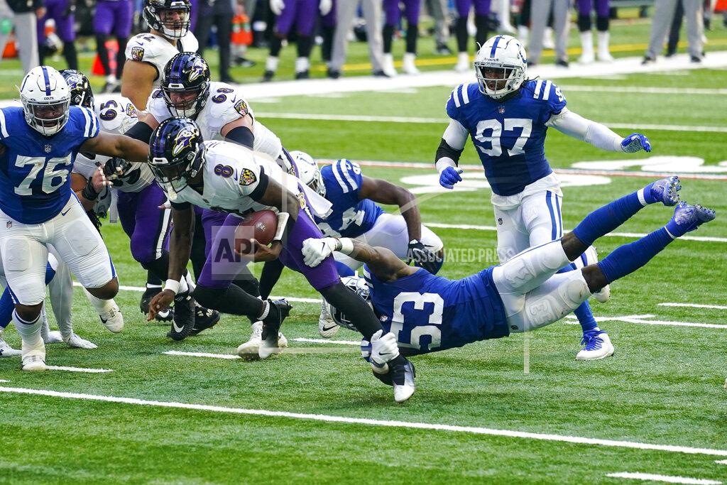 Darron Cummings Baltimore Ravens quarterback Lamar Jackson (8) is tackled by Indianapolis Colts outside linebacker Darius Leonard (53) in the second half of an NFL football game in Indianapolis, Sunday, Nov. 8, 2020. (AP Photo/Darron Cummings)
