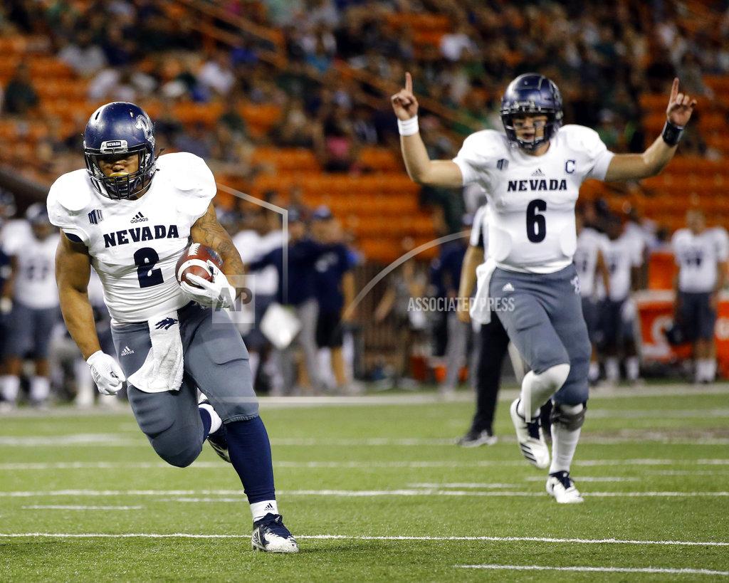 Marco Garcia Nevada quarterback Kaymen Cureton (8) reacts as Nevada running back Devonte Lee (2) attempts to make a touchdown against Hawaii during the second quarter of an NCAA college football game, Saturday, Oct. 20, 2018, in Honolulu. (AP Photo/Marco Garcia)