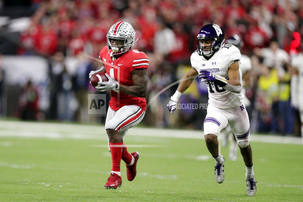 Michael Conroy Ohio State wide receiver Johnnie Dixon (1) is chased by Northwestern defensive back Alonzo Mayo (10) during the second half of the Big Ten championship NCAA college football game, Saturday, Dec. 1, 2018, in Indianapolis. (AP Photo/Michael Conroy)